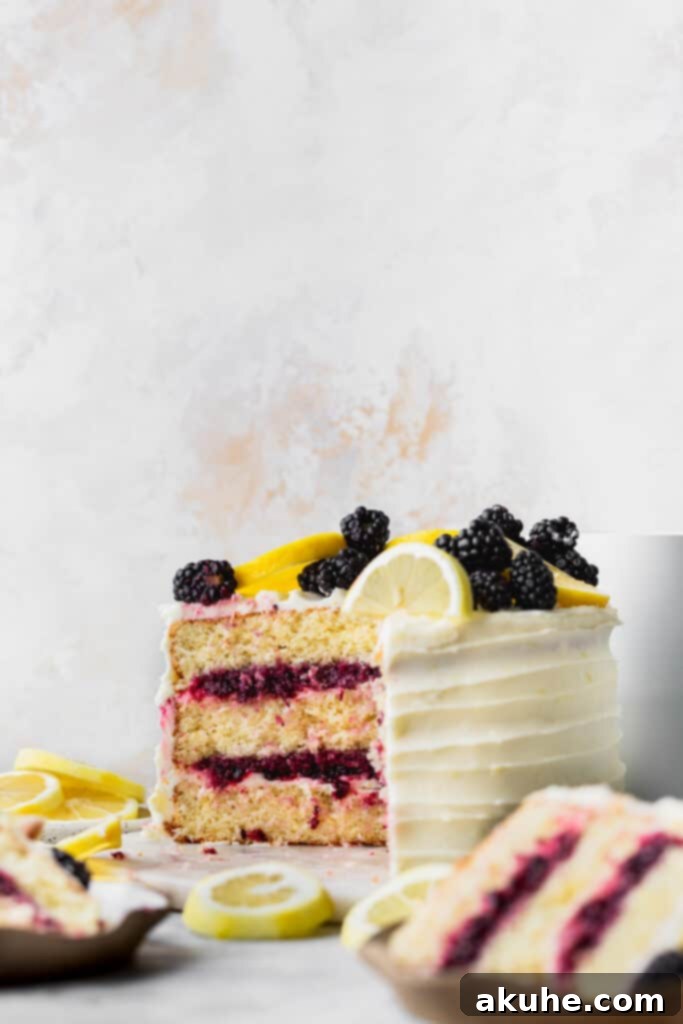 Zesty Lemon Blackberry Delight 3 A beautiful Lemon Blackberry Cake with a slice removed, revealing the delicious layers of cake, jam, and frosting.