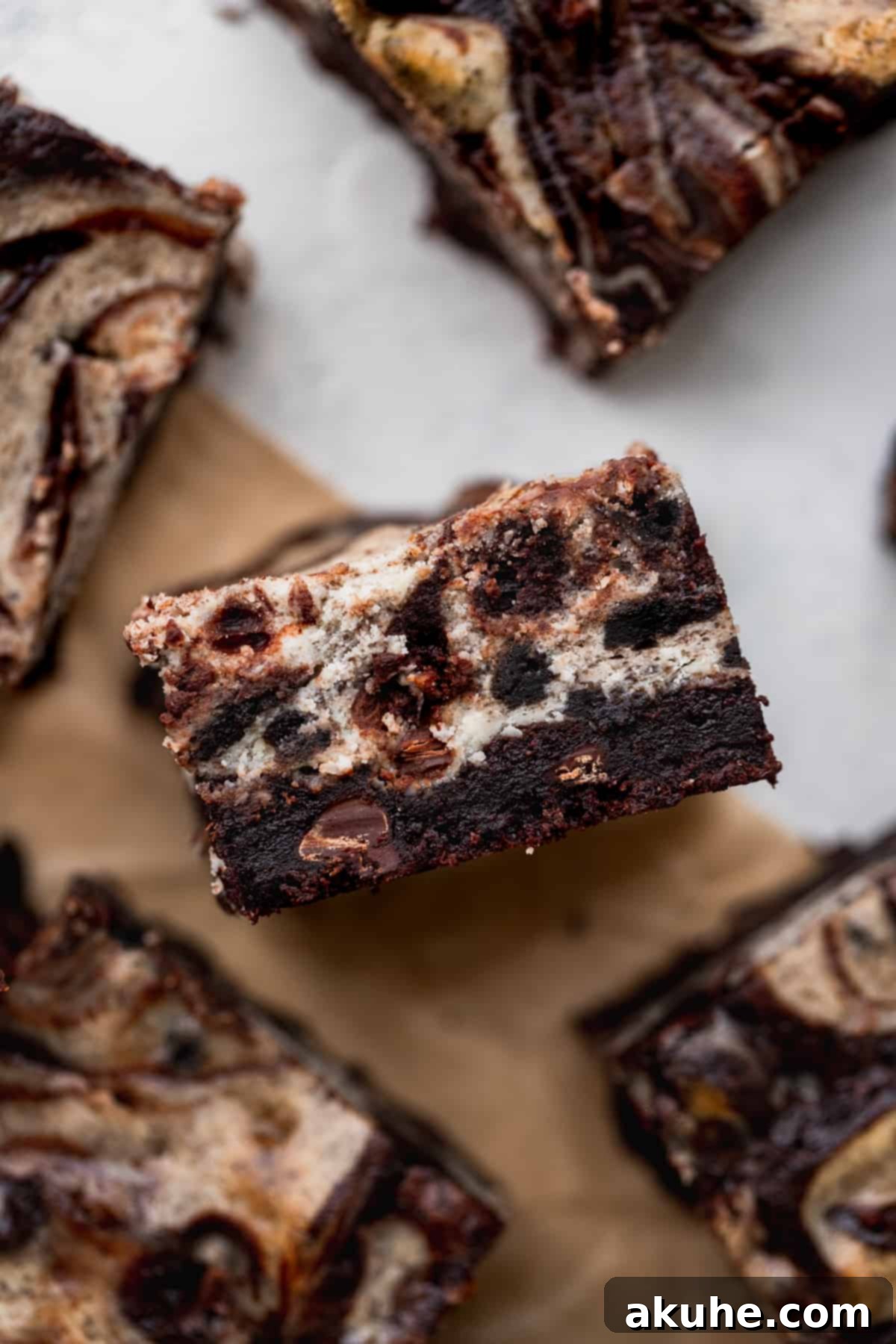 Decadent Oreo Cheesecake Brownies 12 One Oreo cheesecake brownie on its side showing the layers.