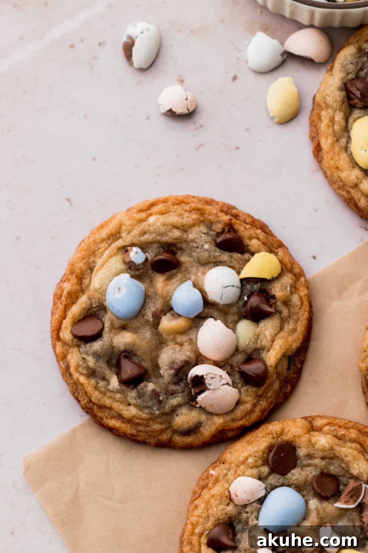 Delicious Mini Egg Cookies 8 A single, perfectly round mini egg cookie on parchment paper.