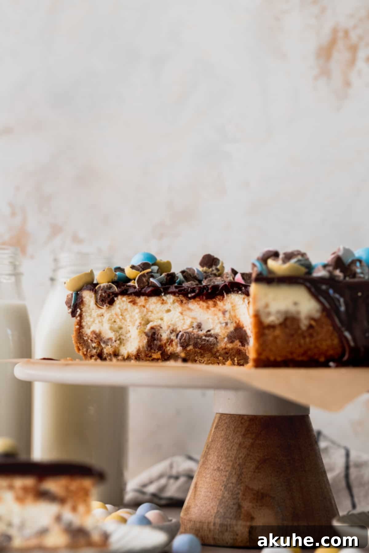 Whimsical Easter Egg Cheesecake 12 Cheesecake side view on a cake stand.