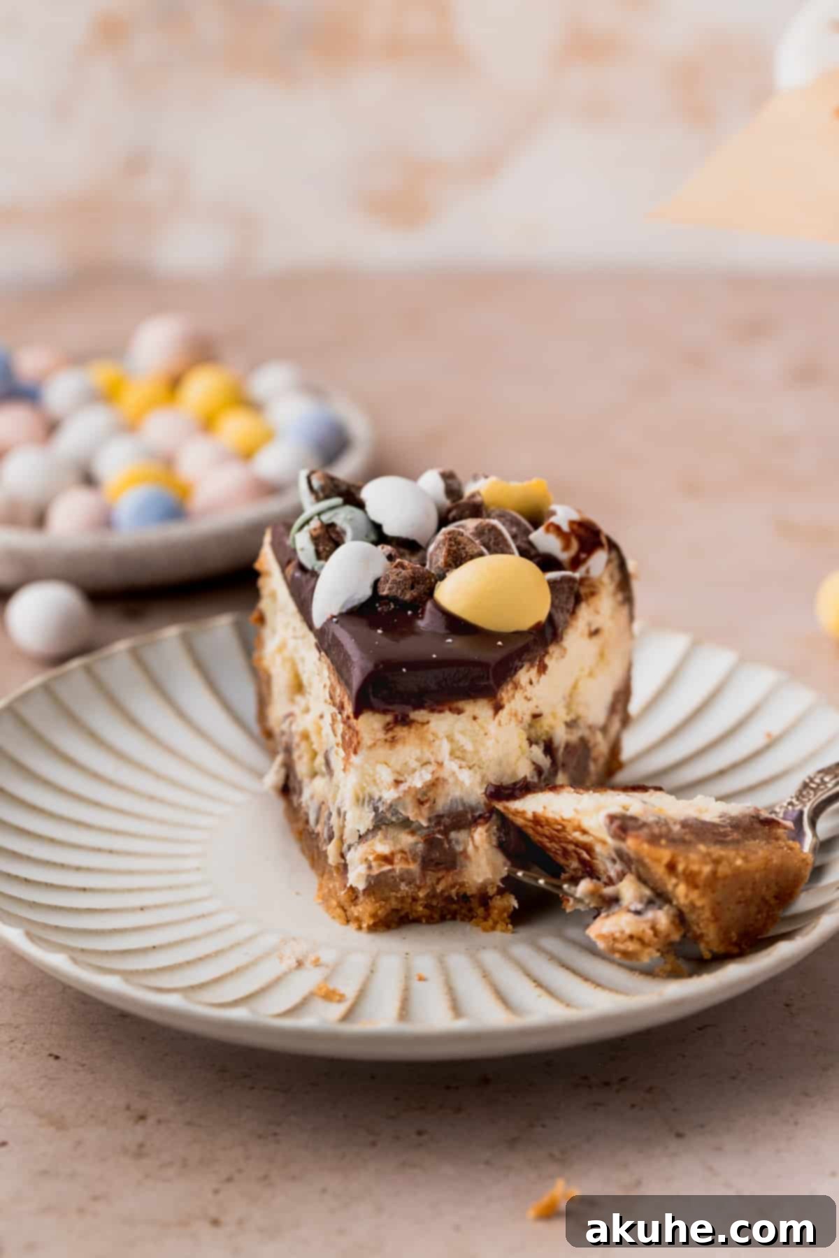 Whimsical Easter Egg Cheesecake 3 One slice of cheesecake on a plate.
