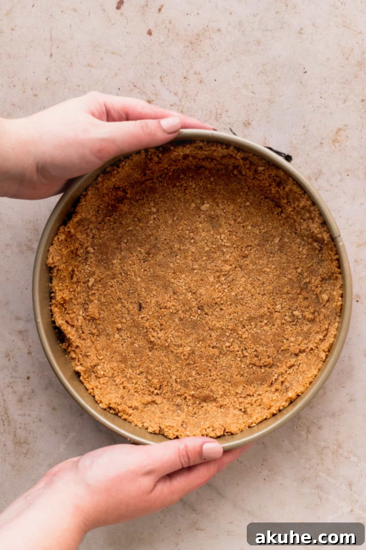 Whimsical Easter Egg Cheesecake 5 Graham cracker crust in a springform pan.