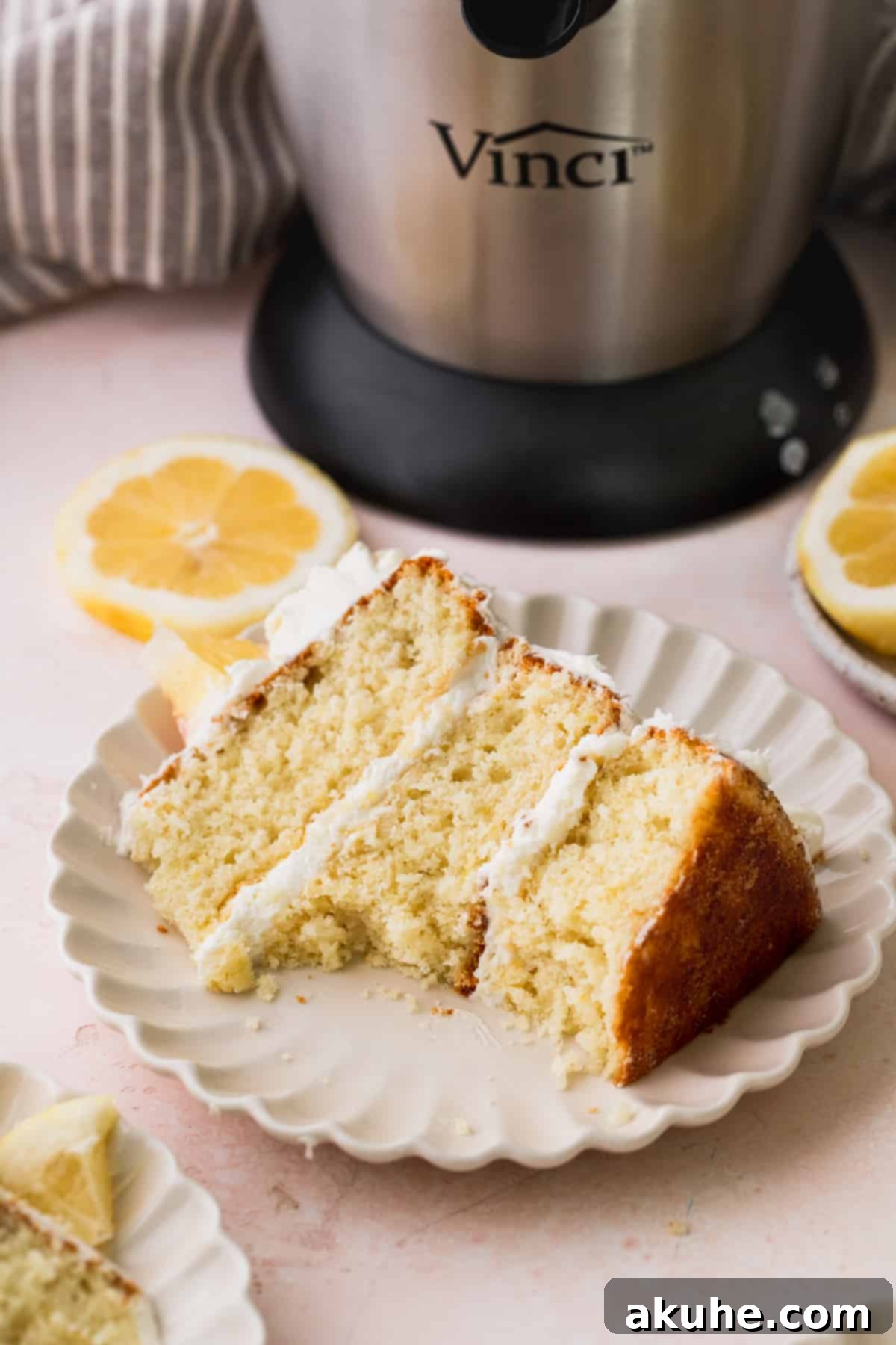 Decadent Lemon White Chocolate Bliss 11 A slice of Lemon White Chocolate Cake with a bite taken out, showing the moist interior.