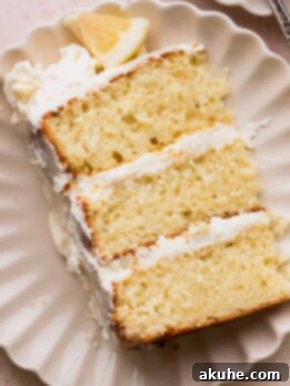 Decadent Lemon White Chocolate Bliss 13 Close up of one slice of lemon white chocolate cake on a plate.