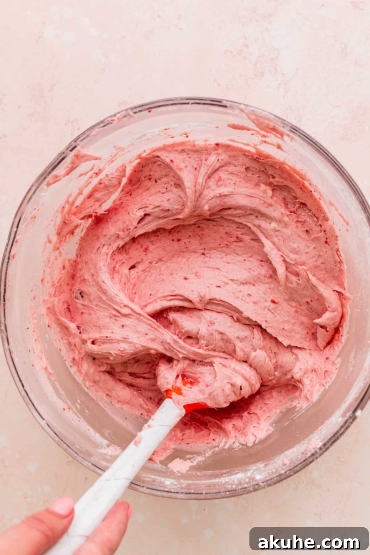 Sweet Strawberry Vanilla Dream 7 Strawberry frosting in a glass bowl, showing its smooth, creamy texture.