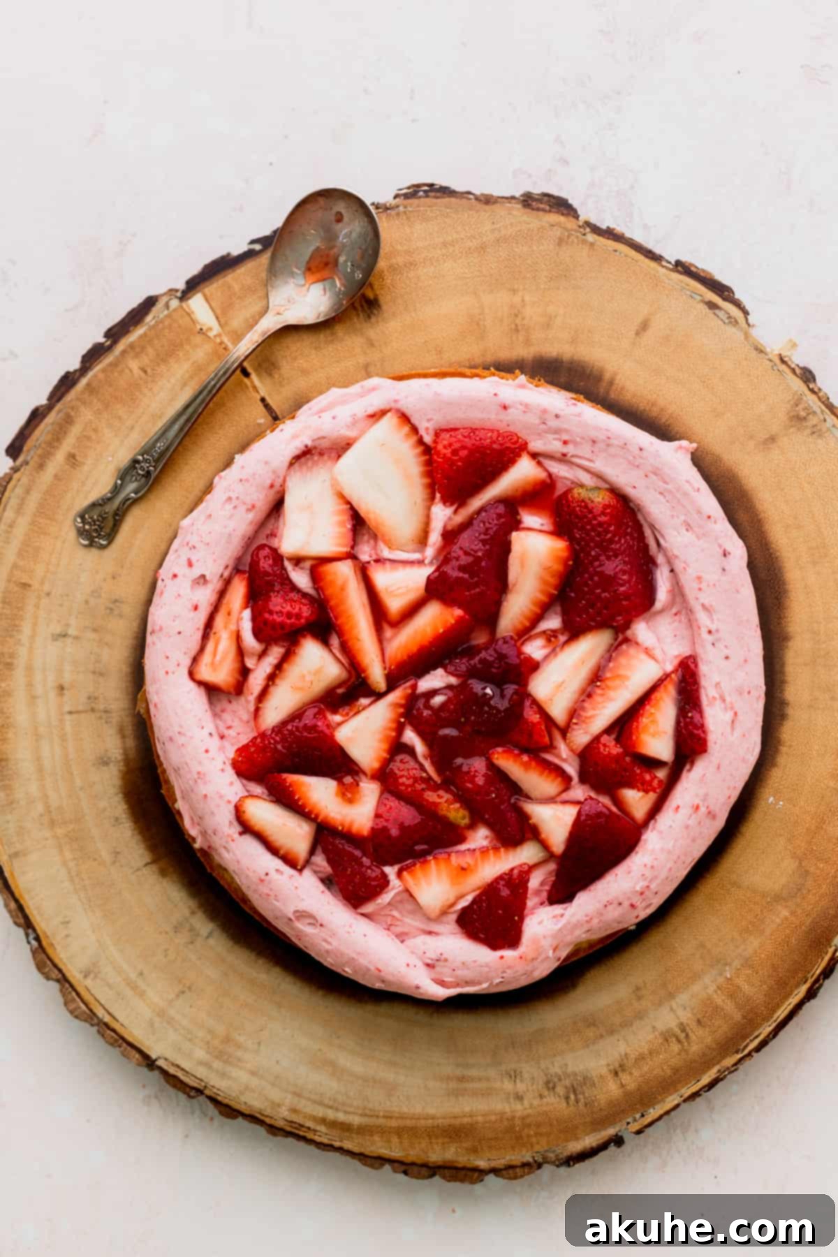 Sweet Strawberry Vanilla Dream 10 Strawberry filling spread evenly on top of a cake layer, contained by a frosting border.