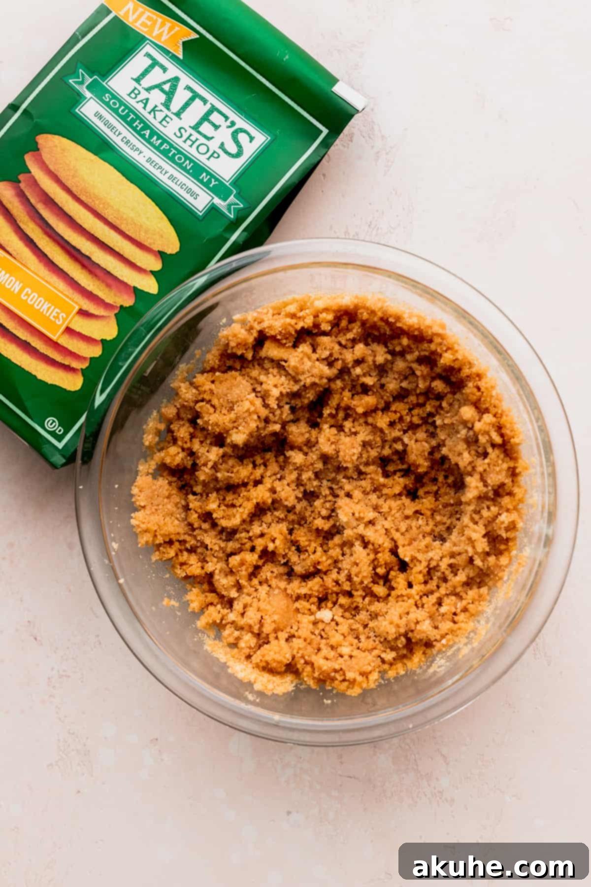 Lemon cookie crust crumbs in a glass bowl.