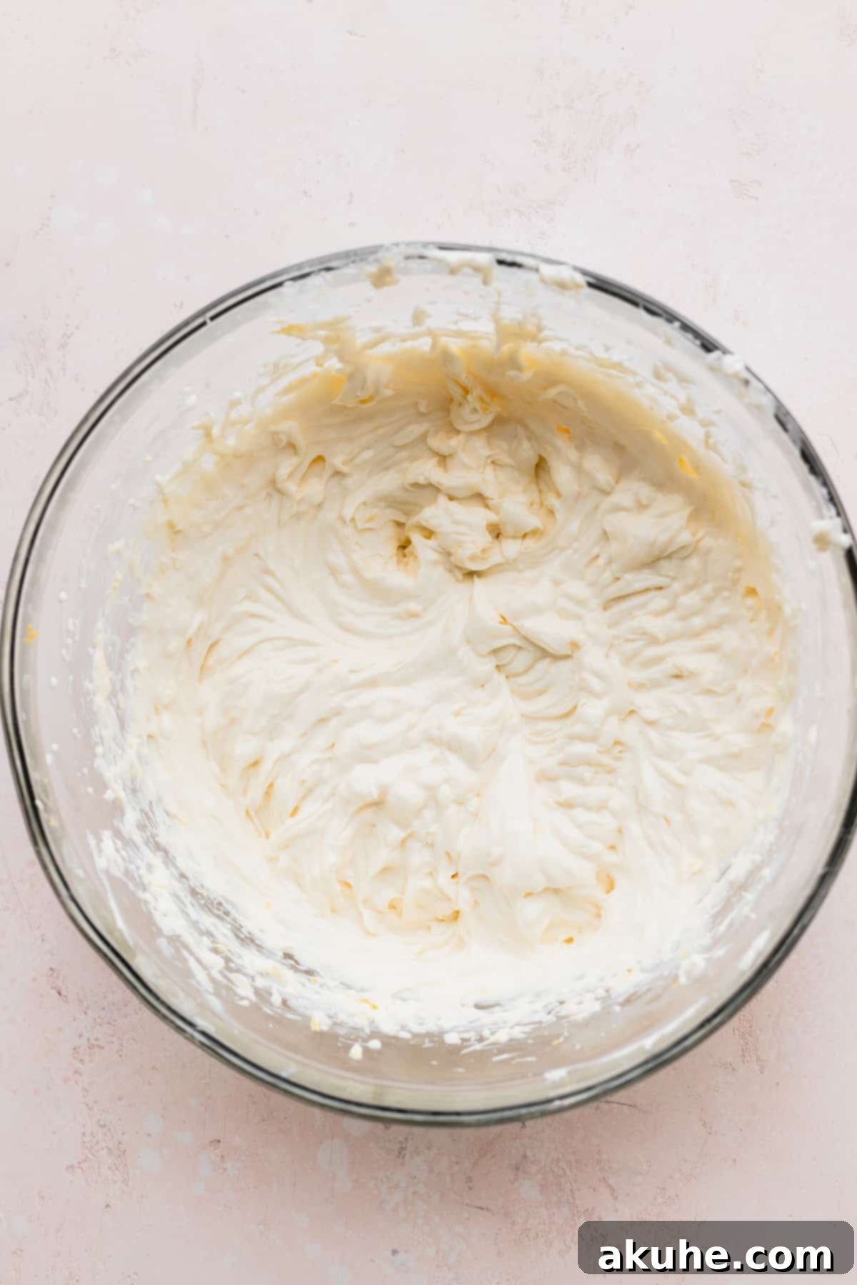 Cream cheese mixture in a glass bowl.