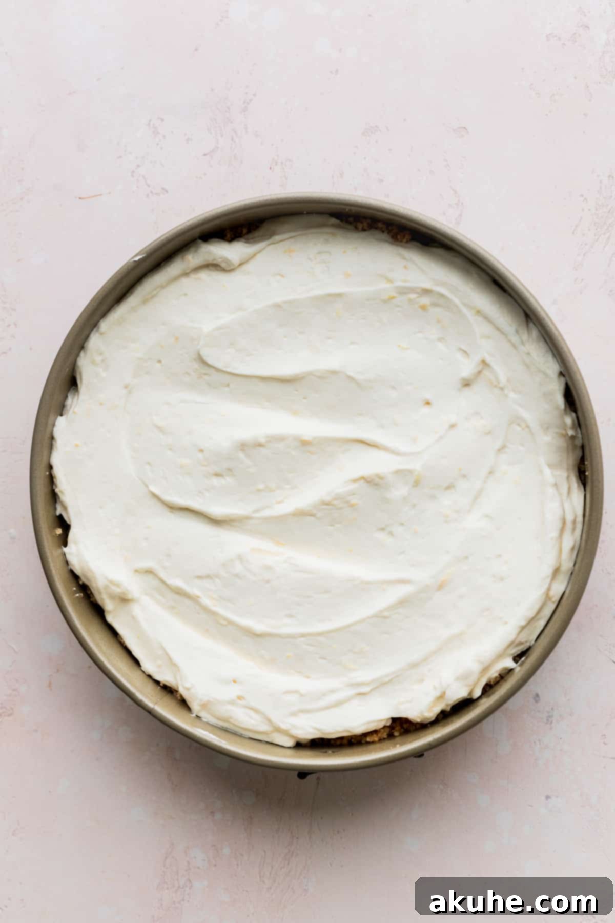 Chilled cheesecake in the springform pan.