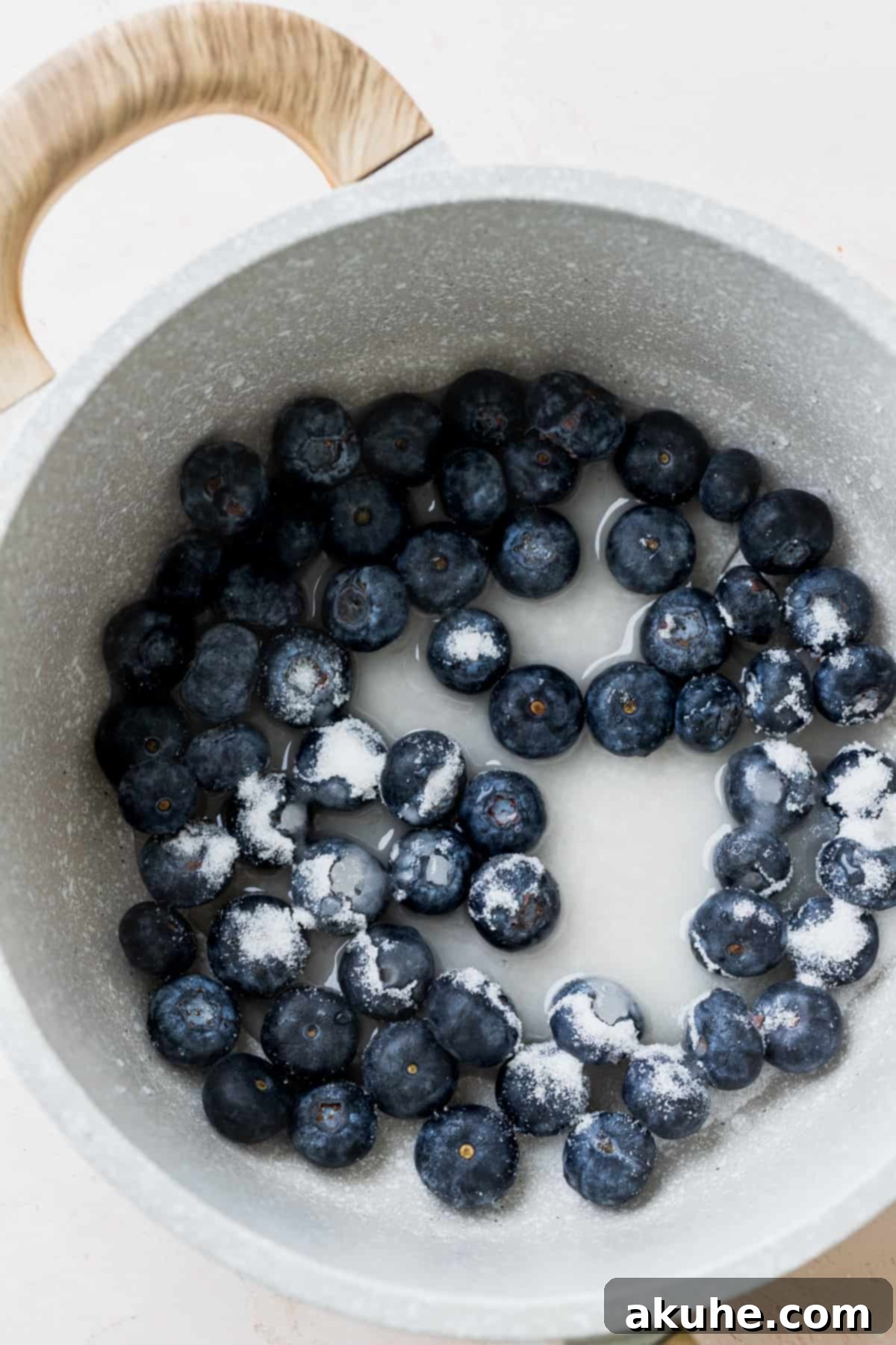 Pot of blueberries simmering on the stove.