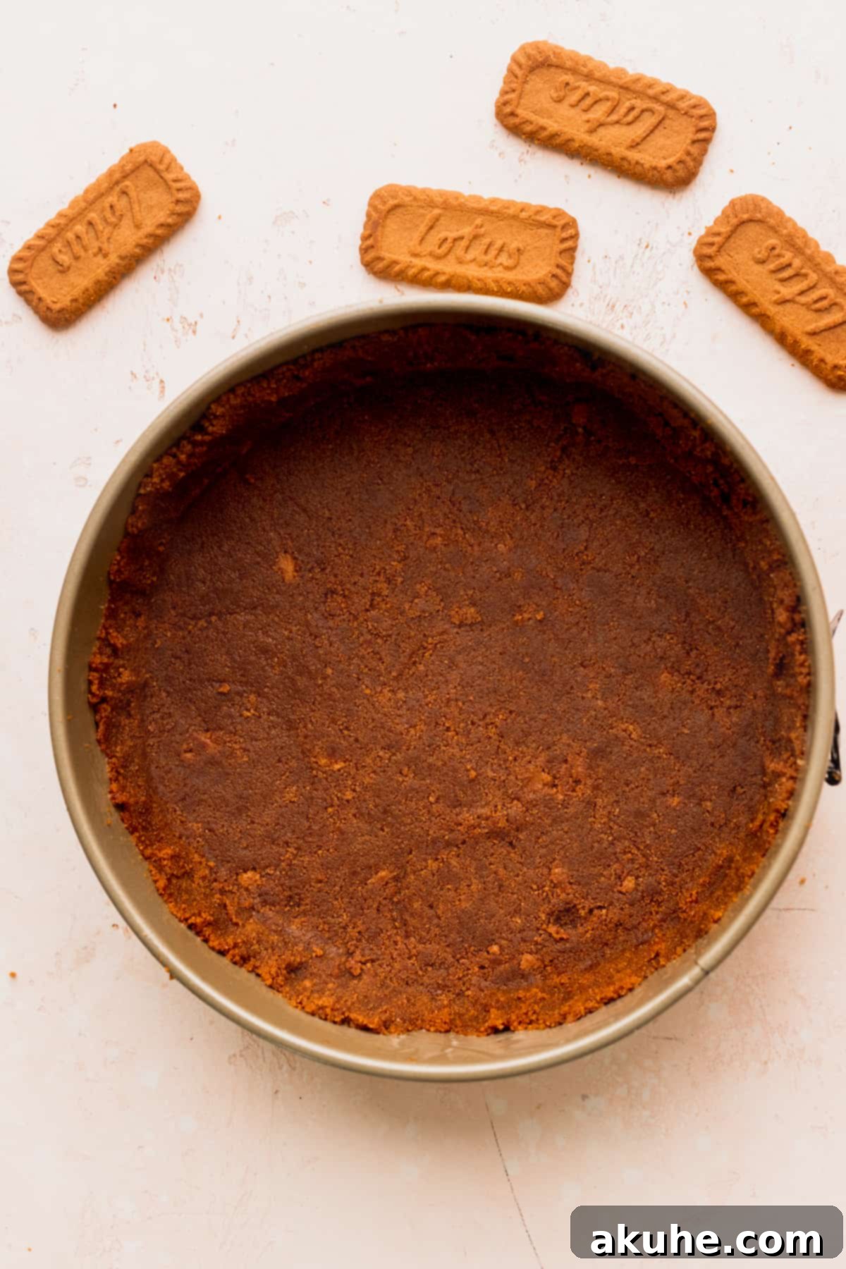 The Ultimate Biscoff Cheesecake 5 A perfectly formed Biscoff cookie crust lining a springform pan, ready for baking.