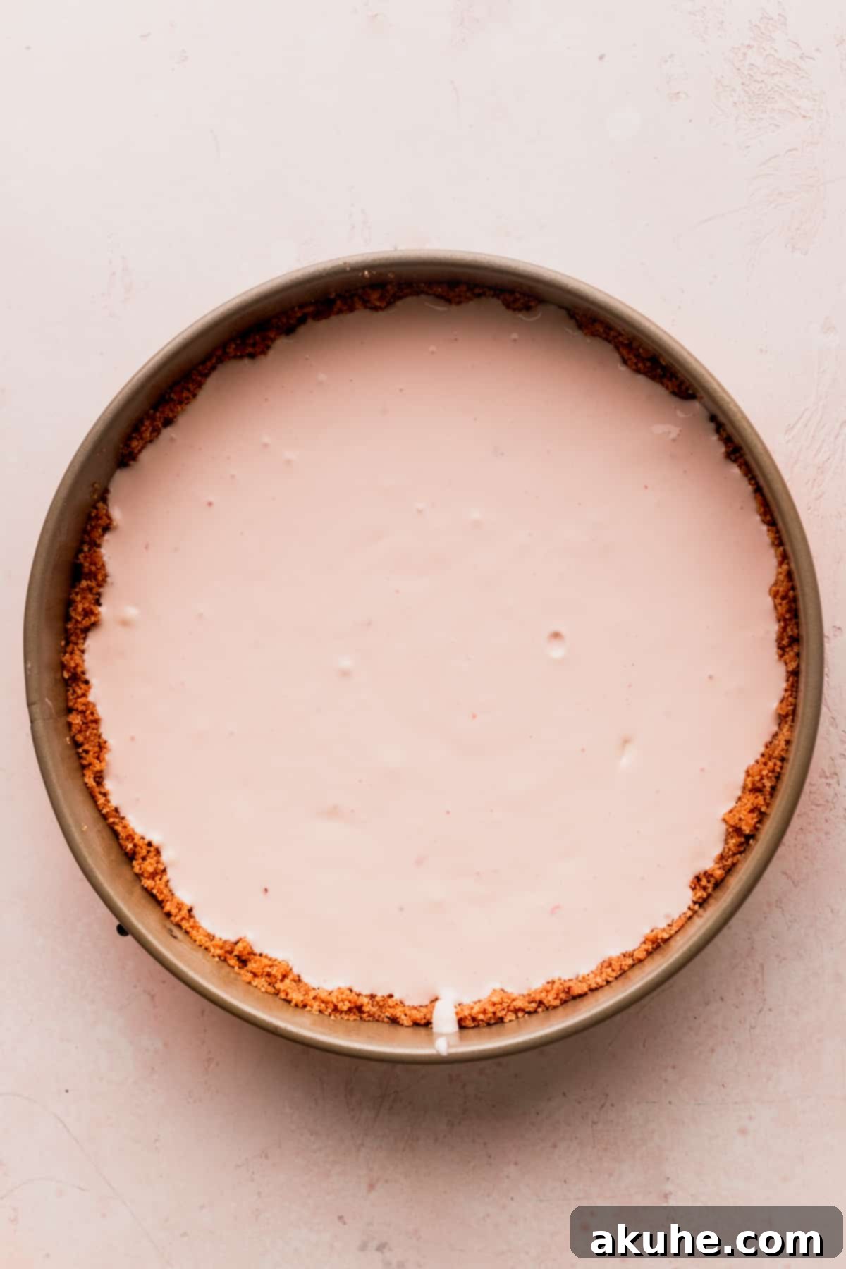 Cheesecake batter poured into the springform pan, ready for freezing.
