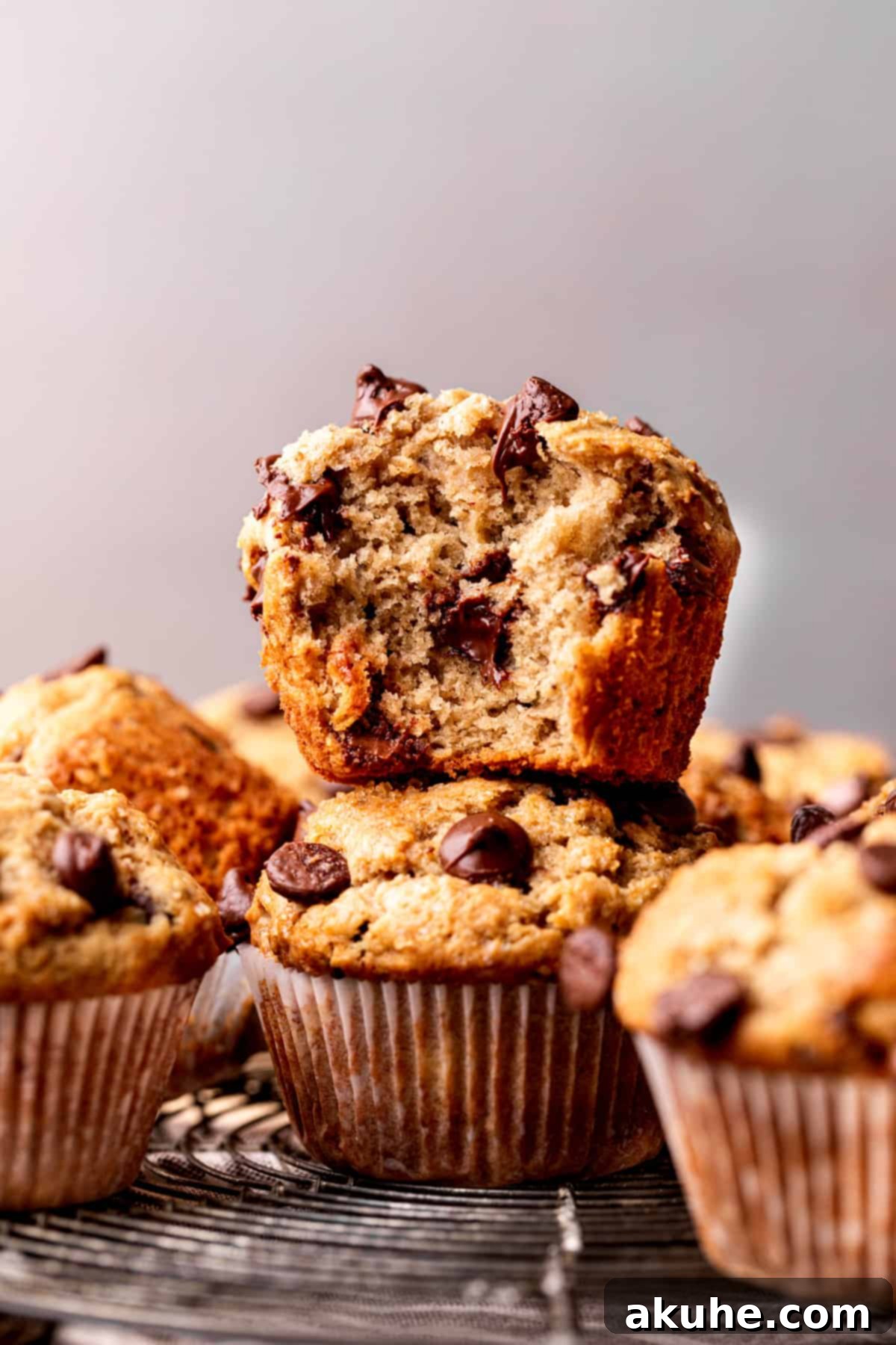 Ultimate Peanut Butter Banana Muffins 9 Stack of two peanut butter banana muffins.