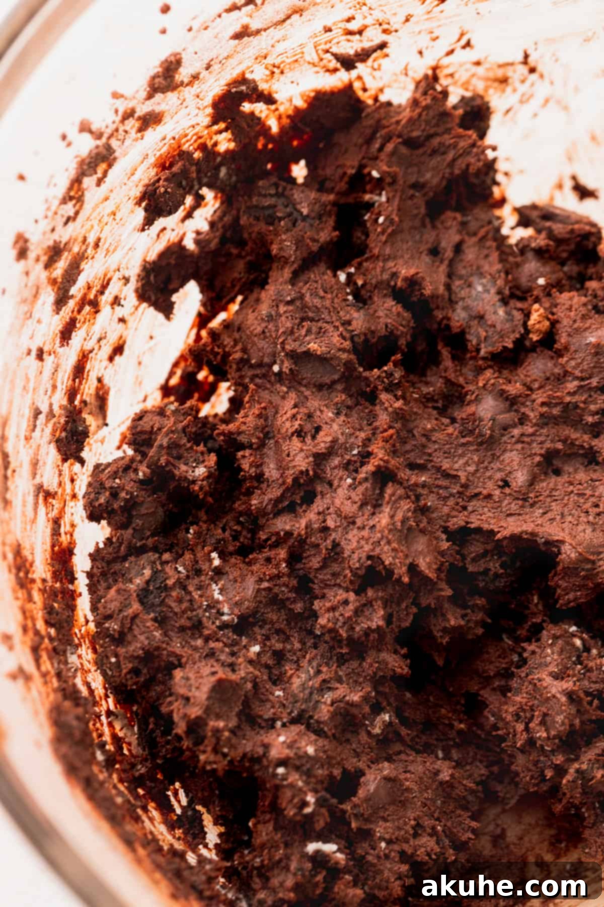 Ultimate Oreo Brookie Indulgence 9 Completed brownie cookie dough in a glass bowl, rich and dark.