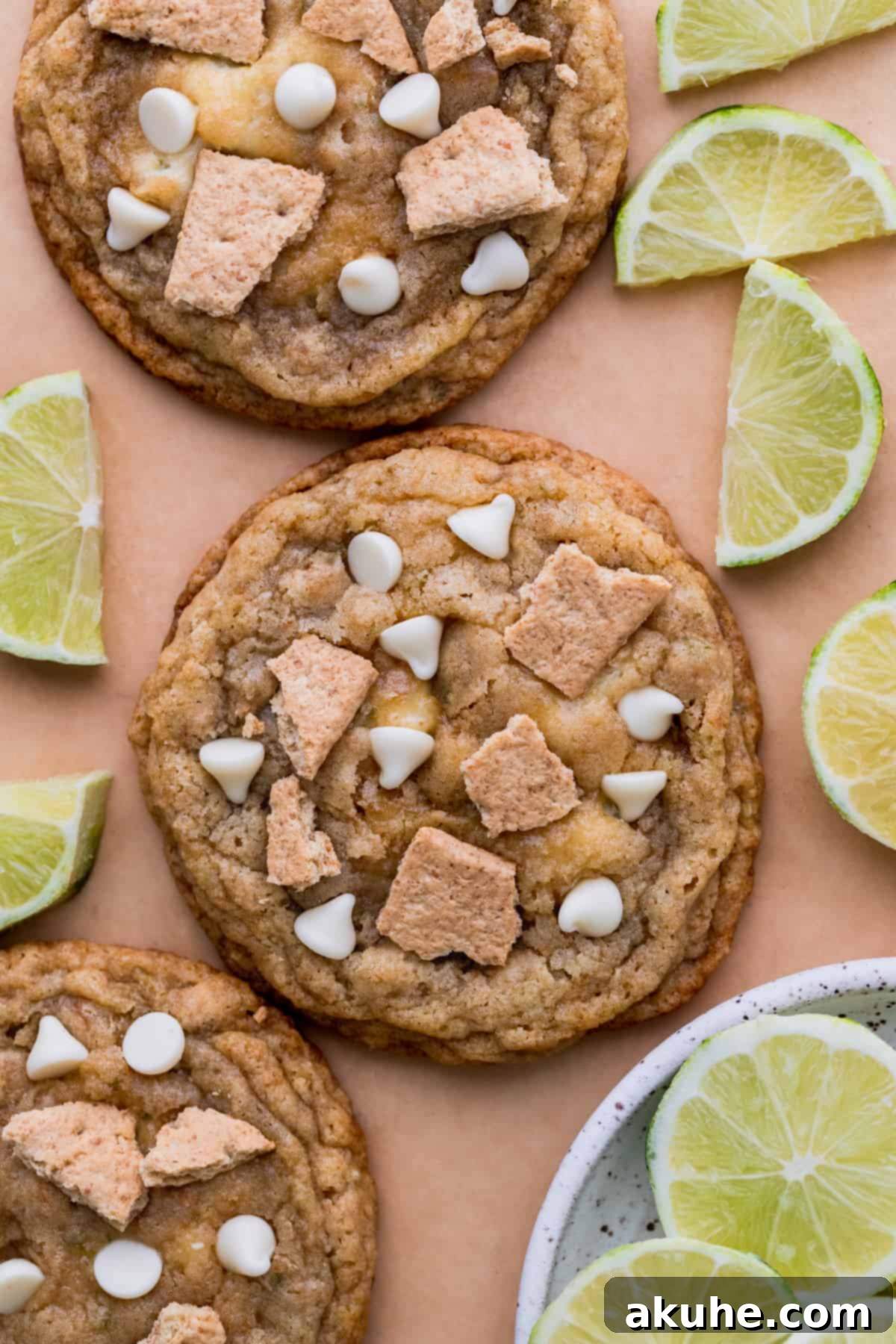 Zesty Key Lime Cookies 11 Freshly baked Key Lime Cookies cooling on parchment paper, perfectly round and golden.