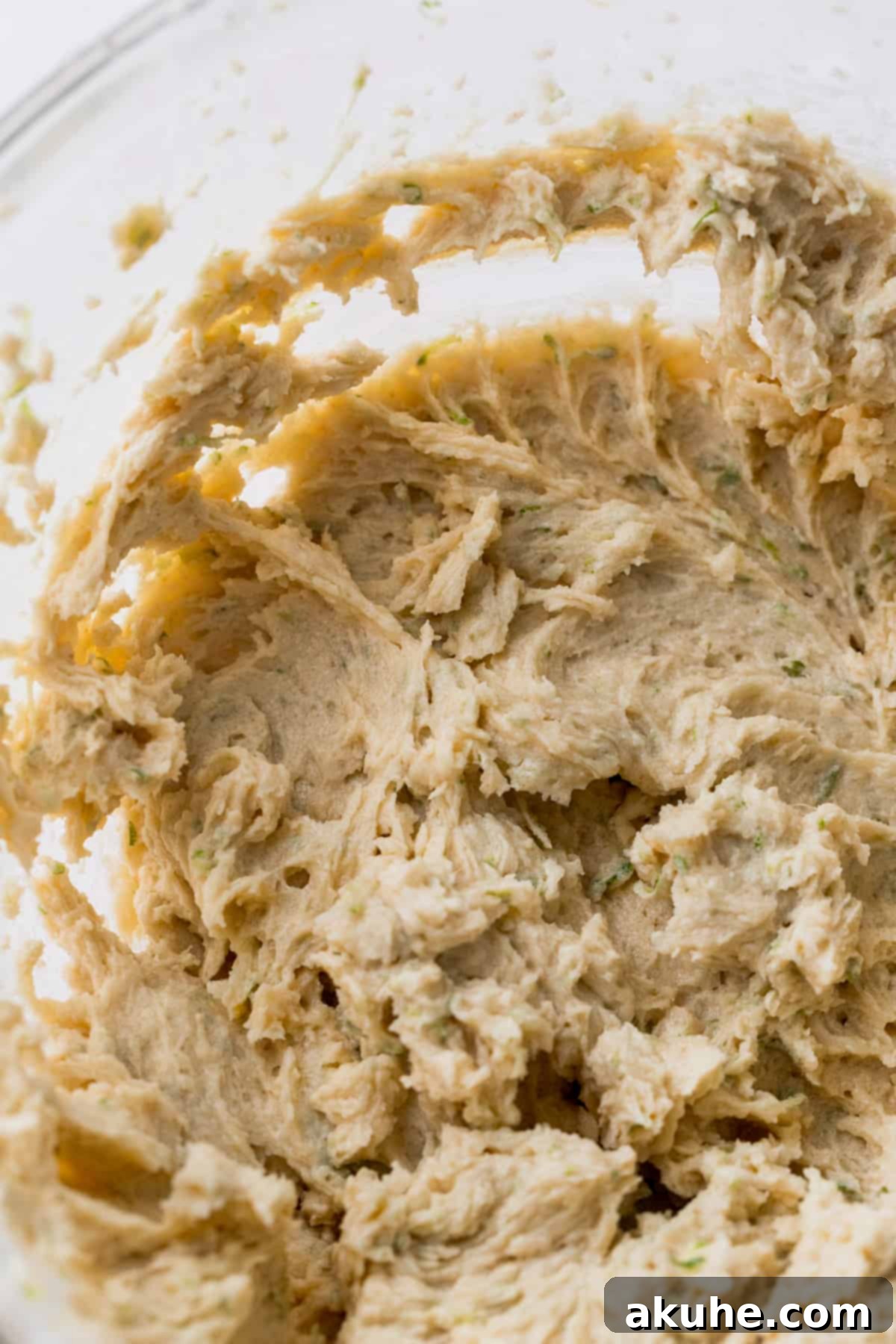 Zesty Key Lime Cookies 6 A bowl of creamy wet ingredients for key lime cookies, mixed to perfection.