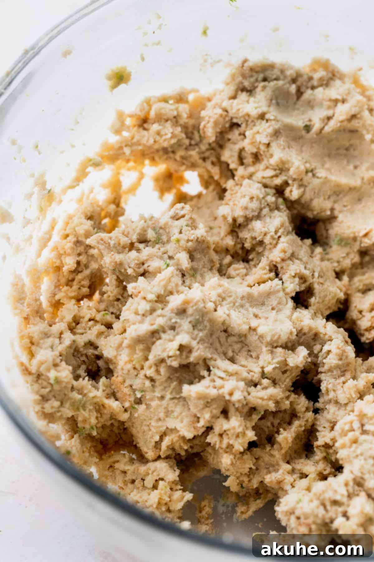 Zesty Key Lime Cookies 7 Smooth key lime cookie dough resting in a clear glass bowl, ready to be chilled.