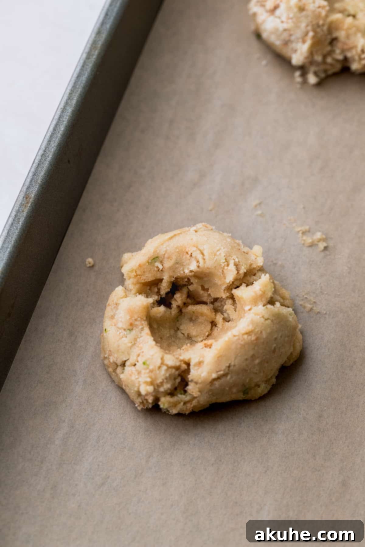 Zesty Key Lime Cookies 8 Cookie dough ball with an indentation made for the cheesecake filling.