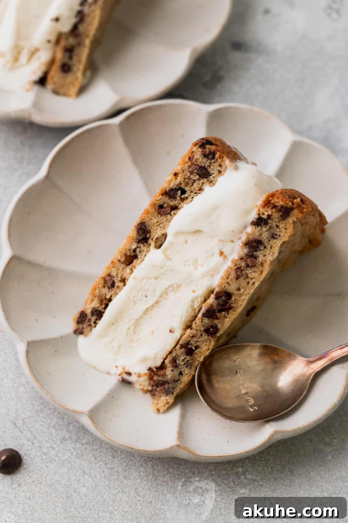 Decadent Cookie Sandwich 11 A single, perfectly cut slice of the ice cream cookie sandwich on a plate.