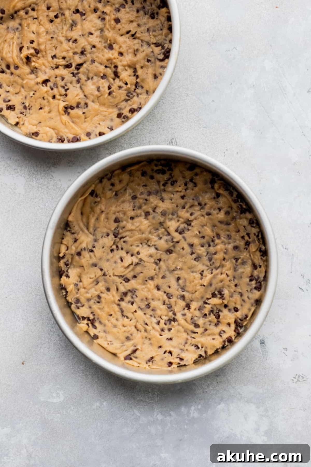 Decadent Cookie Sandwich 8 Cookie dough divided and pressed into two cake pans, ready for baking.