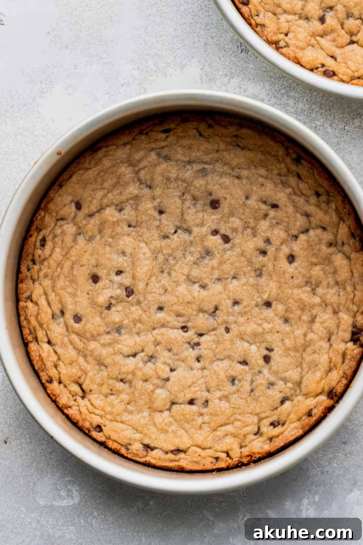 Decadent Cookie Sandwich 9 One baked cookie layer cooling in a cake pan.