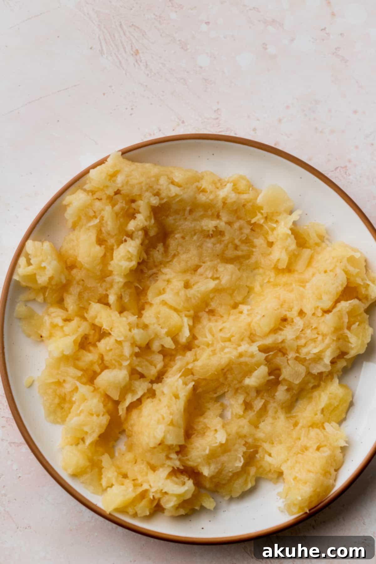 Tropical Pineapple Delight 5 Well-drained crushed pineapple on a plate, ready for the cake batter.