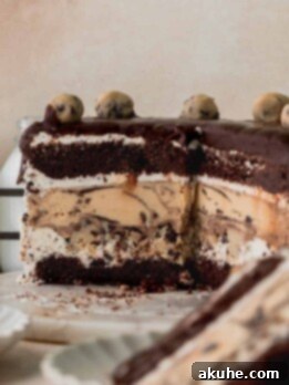 Ultimate Cookie Dough Ice Cream Cake 16 Cookie dough ice cream cake on a marble board cut into.