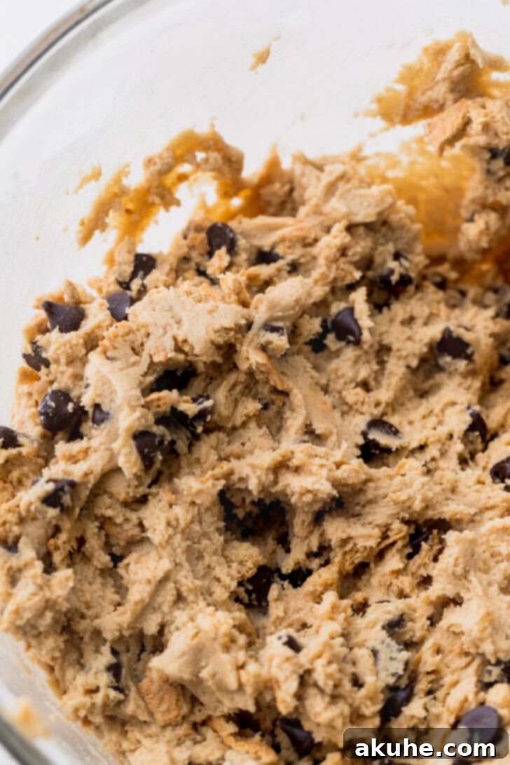 Gooey S'mores Cookies 6 A bowl of cookie dough, ready for chilling, which is a crucial step for optimal texture and preventing excessive spreading.