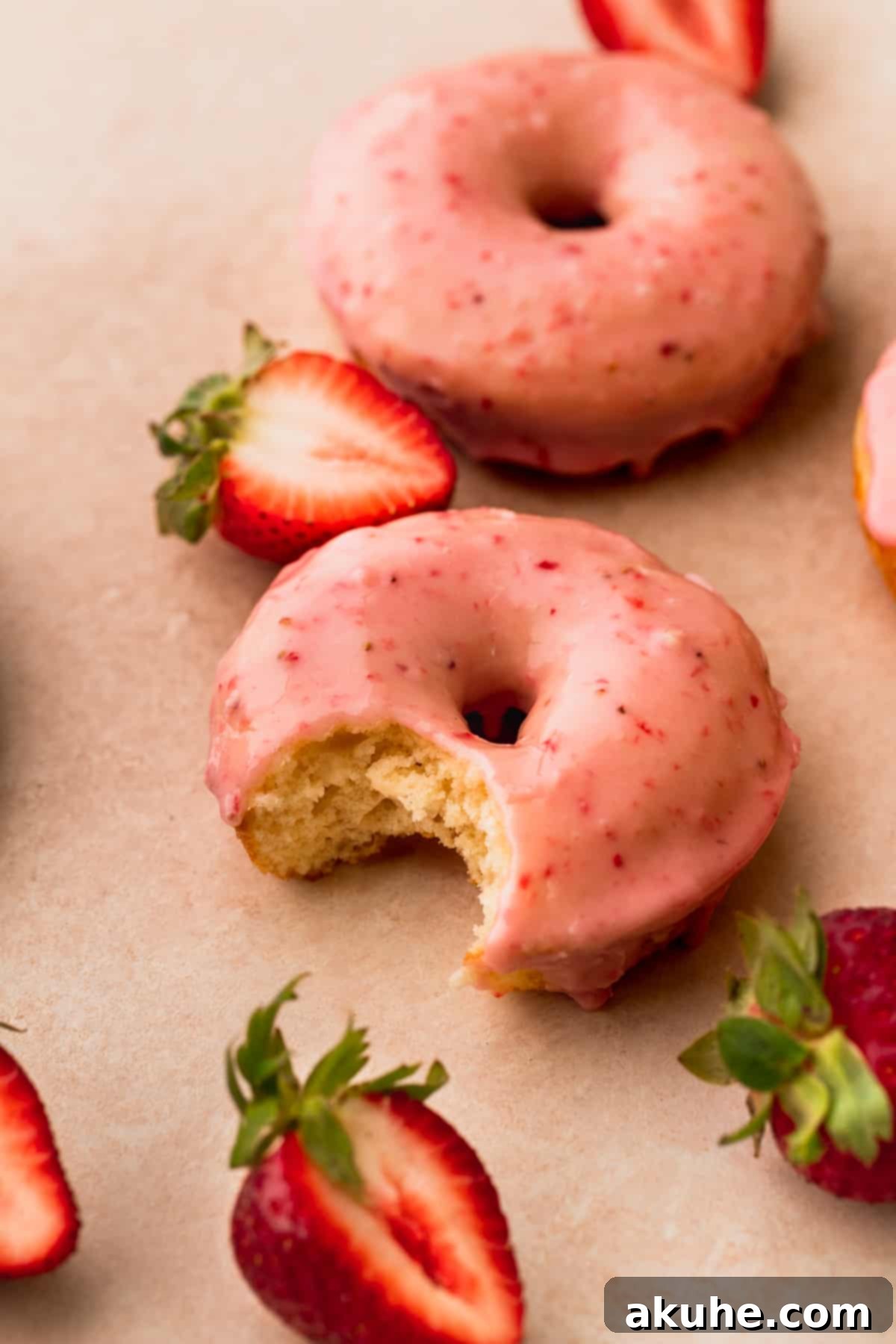 Glazed Strawberry Treats 3 Bite missing from one donut.