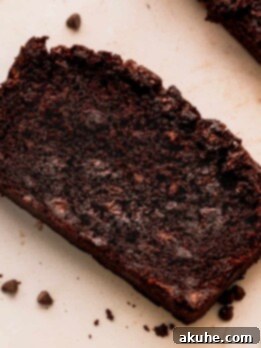 Decadent Double Chocolate Banana Bread 11 One slice of double chocolate banana bread with chocolate chips around it.