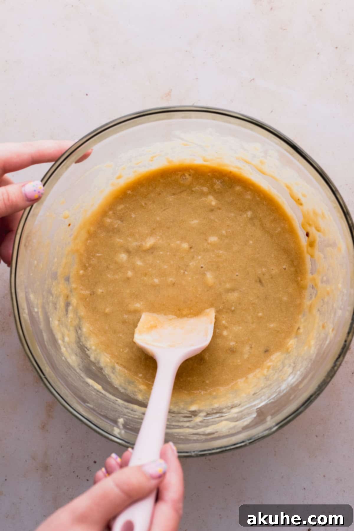 Decadent Double Chocolate Banana Bread 4 A bowl filled with the perfectly mixed wet ingredients for banana bread, showcasing a rich, smooth consistency.