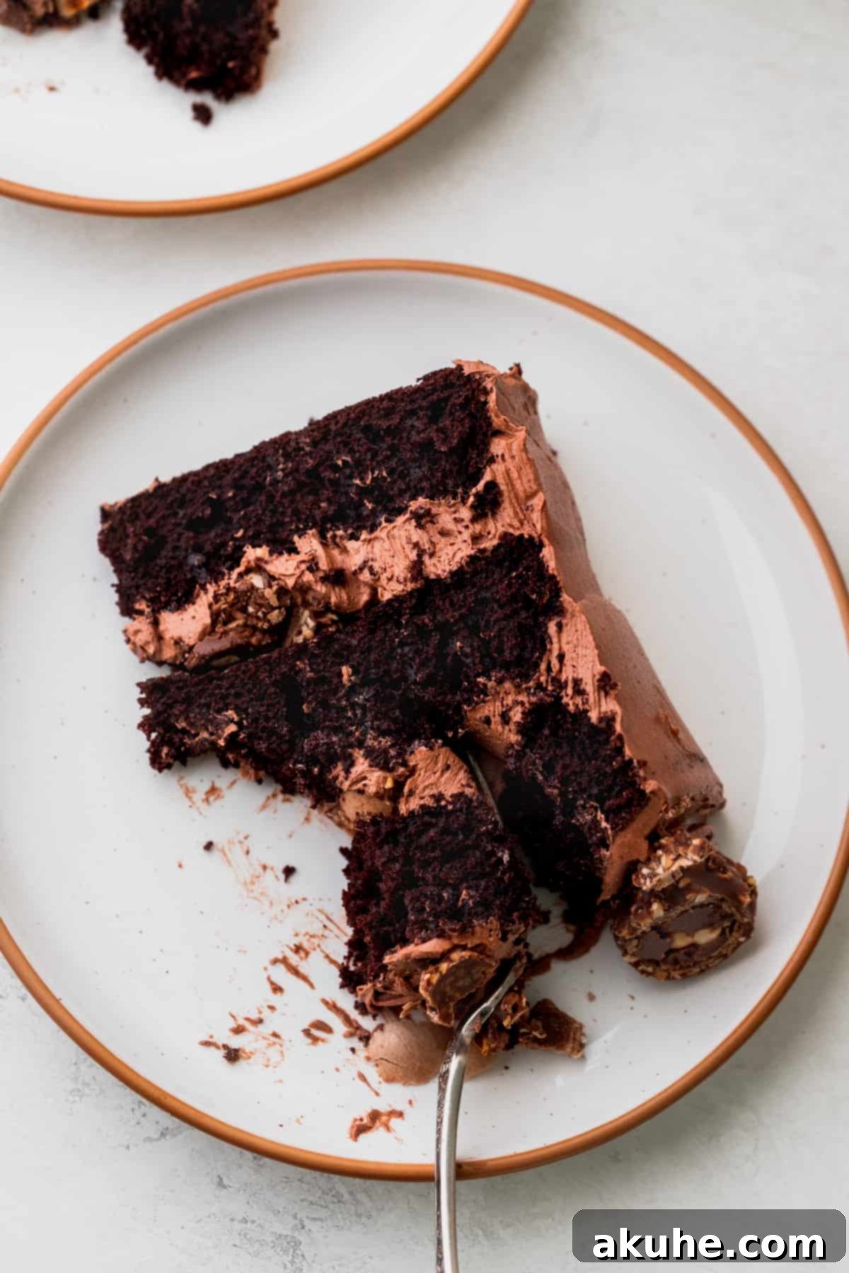 One slice of Ferrero Rocher cake with a fork.