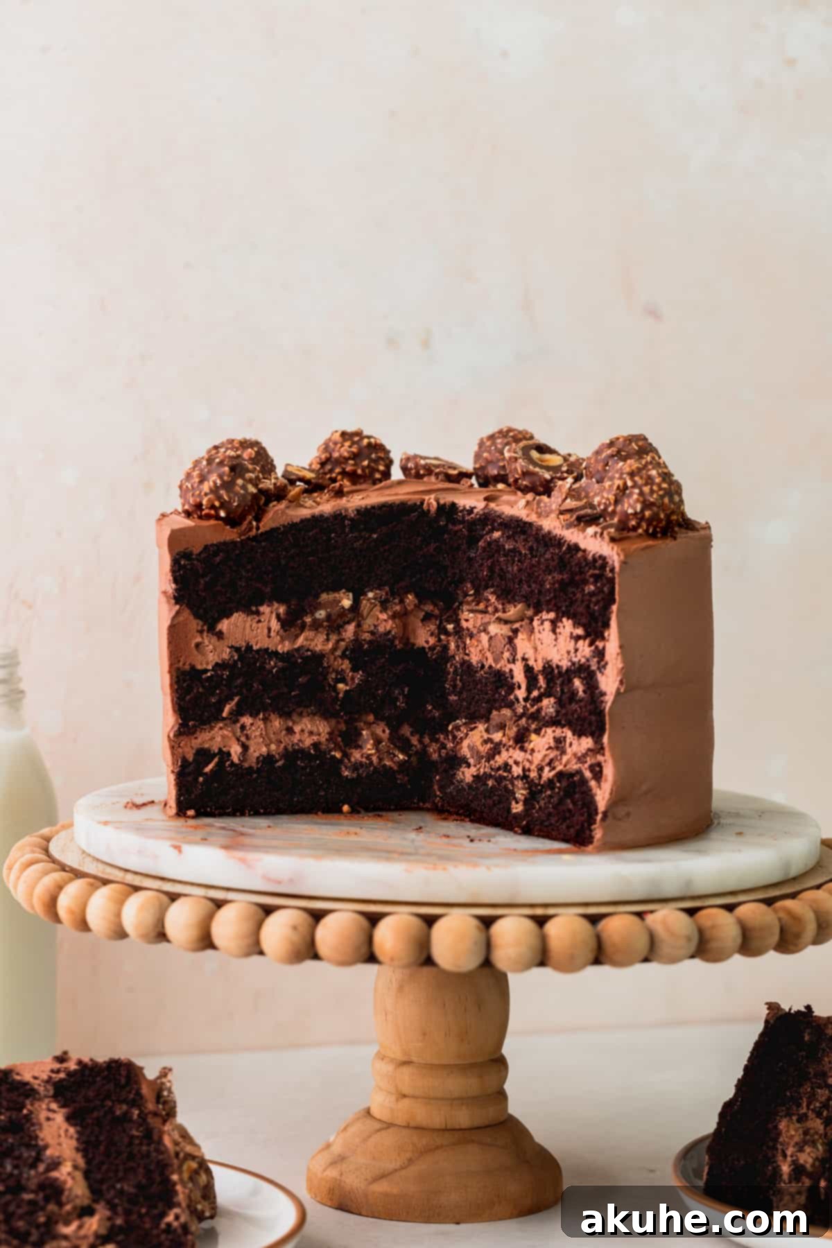 Cake sliced in half on a cake stand.