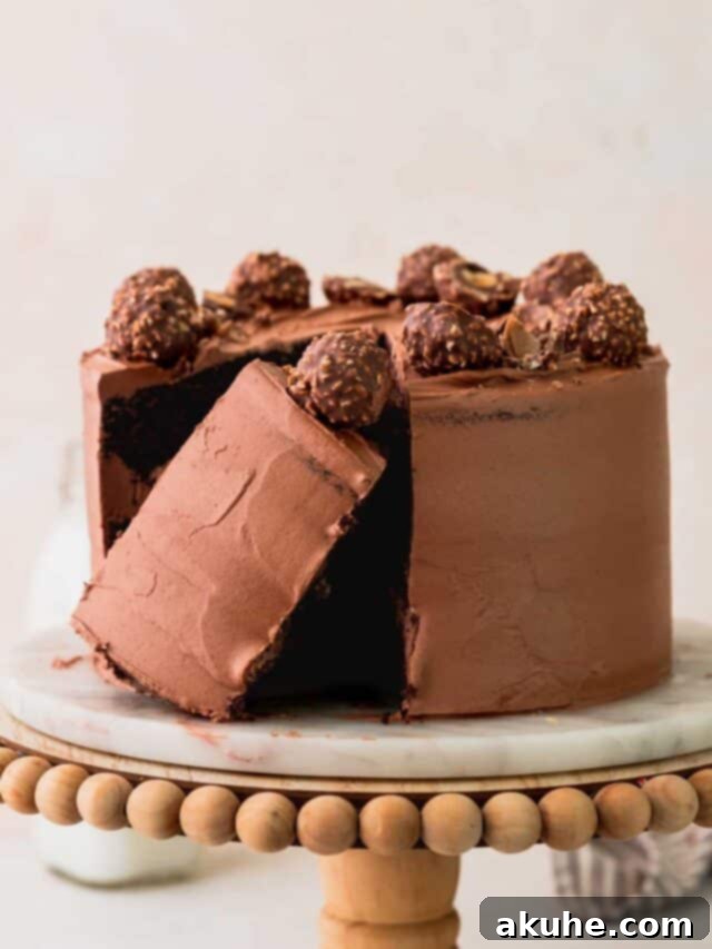 Ferrero Rocher cake on a cake stand.