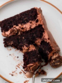 Slice of ferrero rocher cake on a plate.