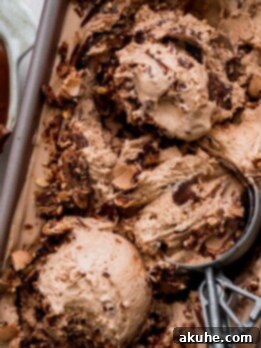 Nutella ice cream in a tin with an ice cream scoop.