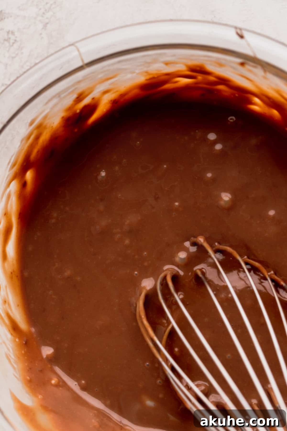 Nutella and sweetened condensed milk expertly mixed in a bowl.