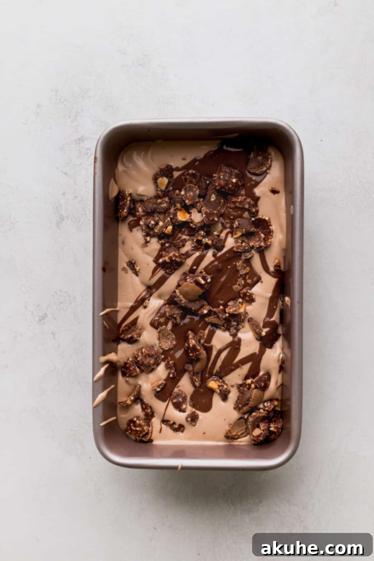 First layer of Nutella ice cream mixture poured into the tin.