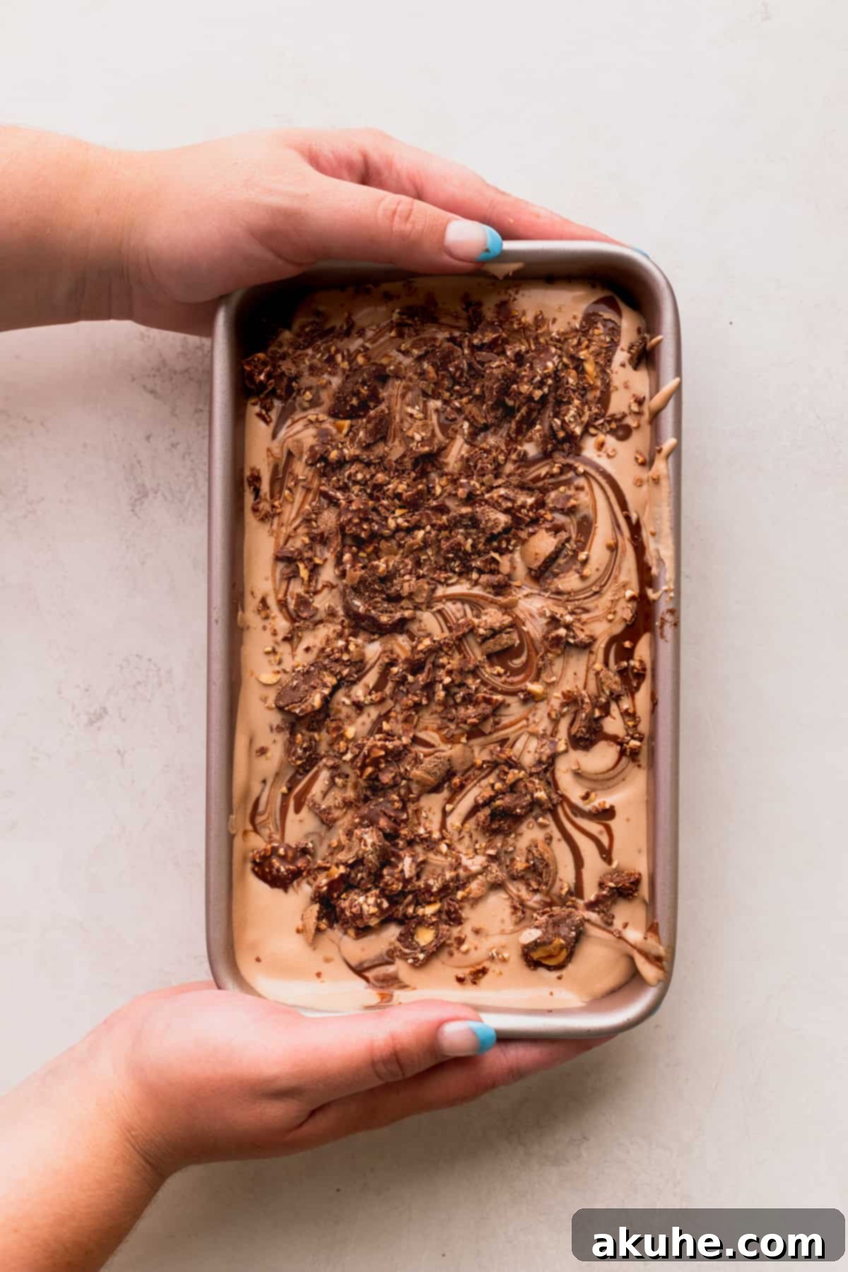 Fully assembled Nutella ice cream in a pan, ready for freezing.