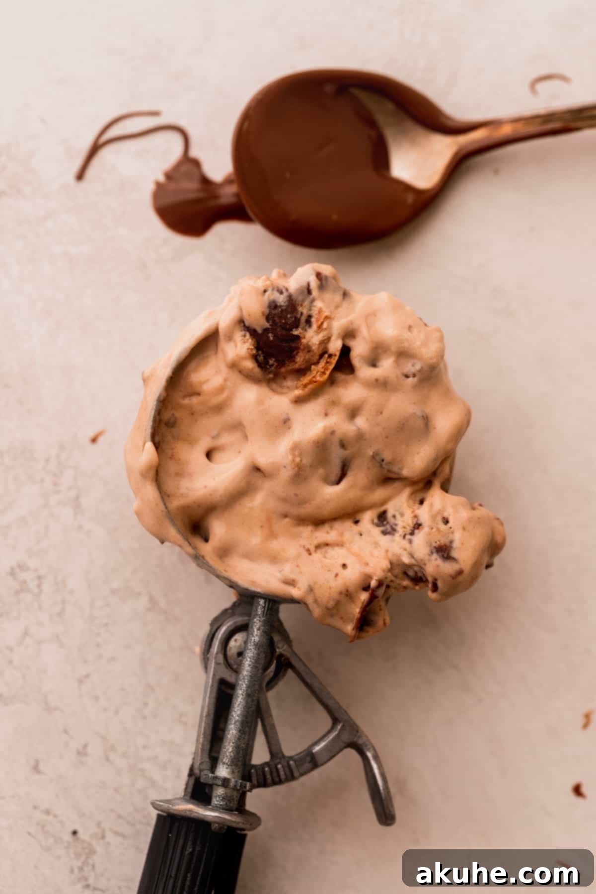 A perfectly scooped ball of Nutella ice cream, rich and inviting.