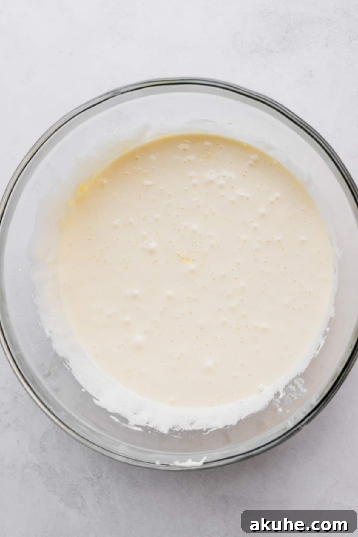 Snickers Brownies 4 Whipped sugar in a glass bowl.