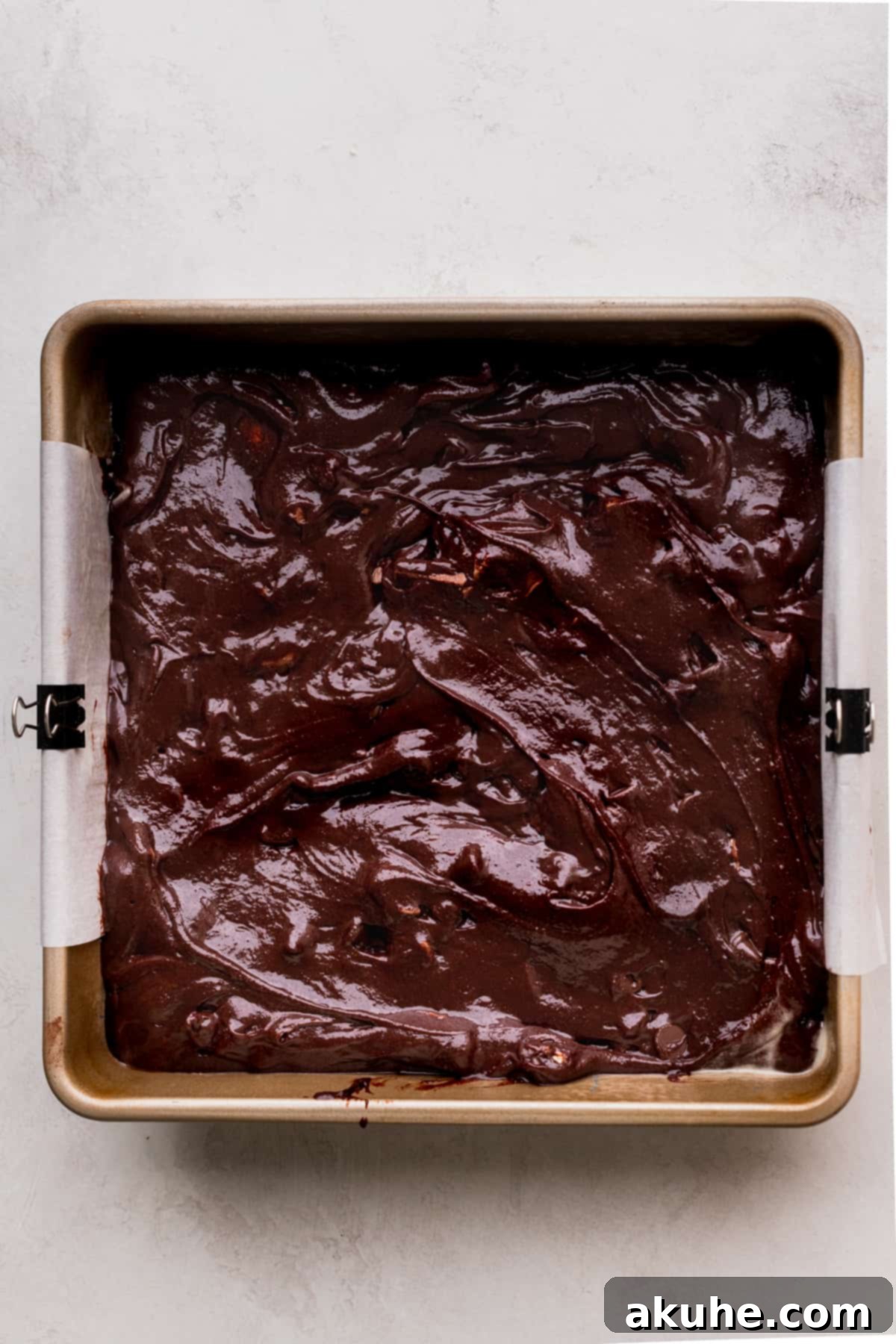 Snickers Brownies 7 Brownie batter in the pan.