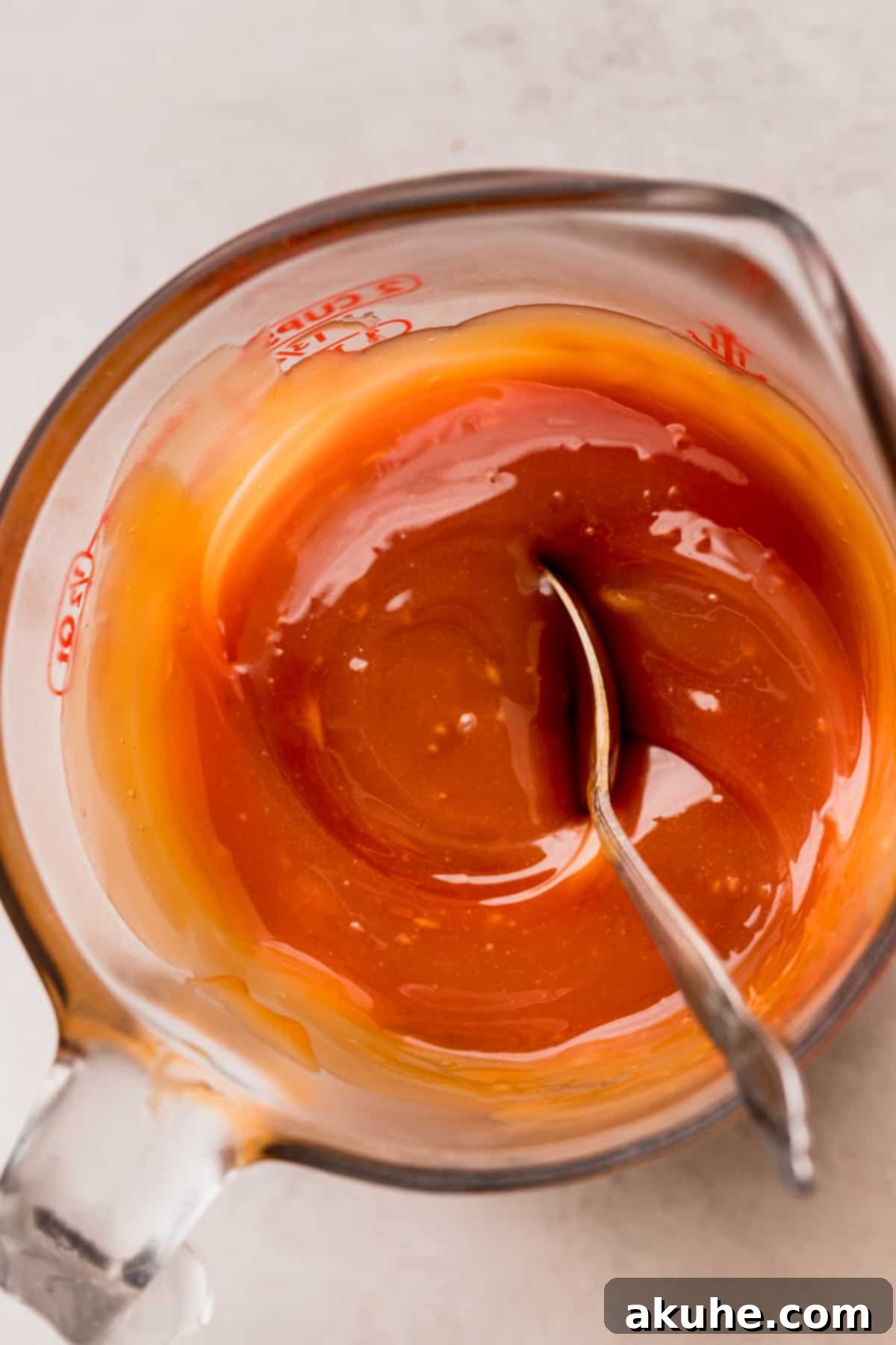 Homemade Salted Caramel Delights 9 Spoon inside the homemade salted caramel, showing its thick texture.