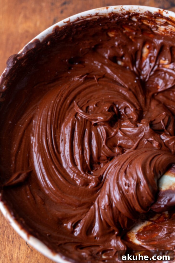 Decadent Triple Chocolate Cake 7 Whipped chocolate ganache in a bowl.