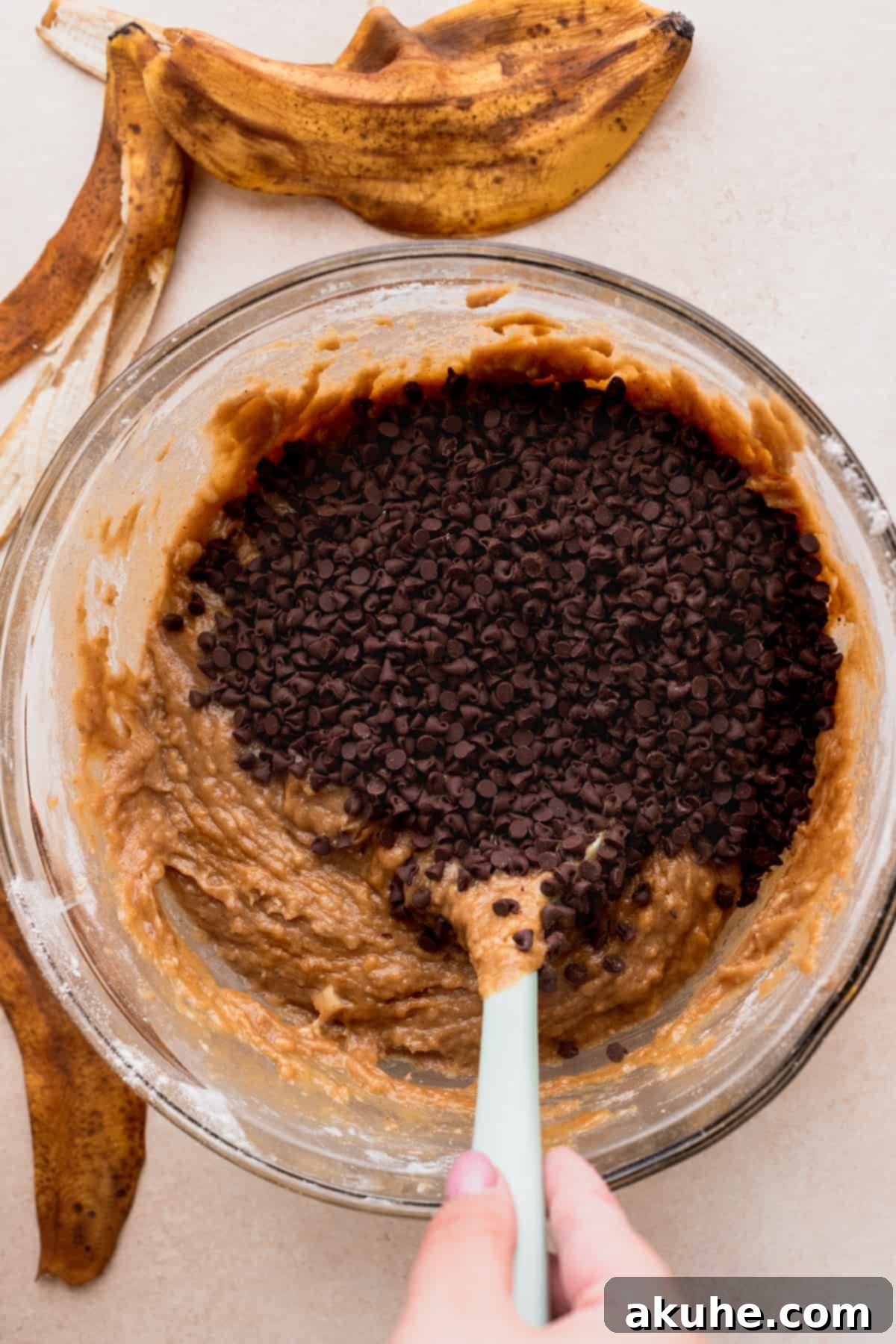 Bowl containing sifted dry ingredients: flour, baking soda, salt, and cinnamon.