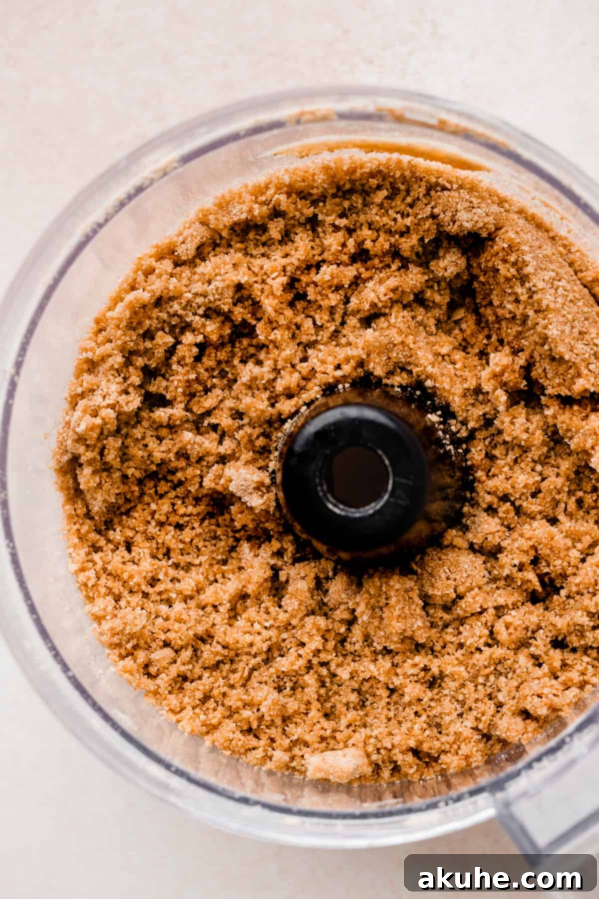 MM Cheesecake Bliss 4 Graham cracker crumbs mixed in a bowl, ready for the crust.