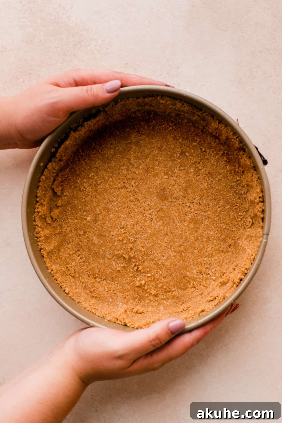 MM Cheesecake Bliss 5 Graham cracker crust pressed into a springform pan.