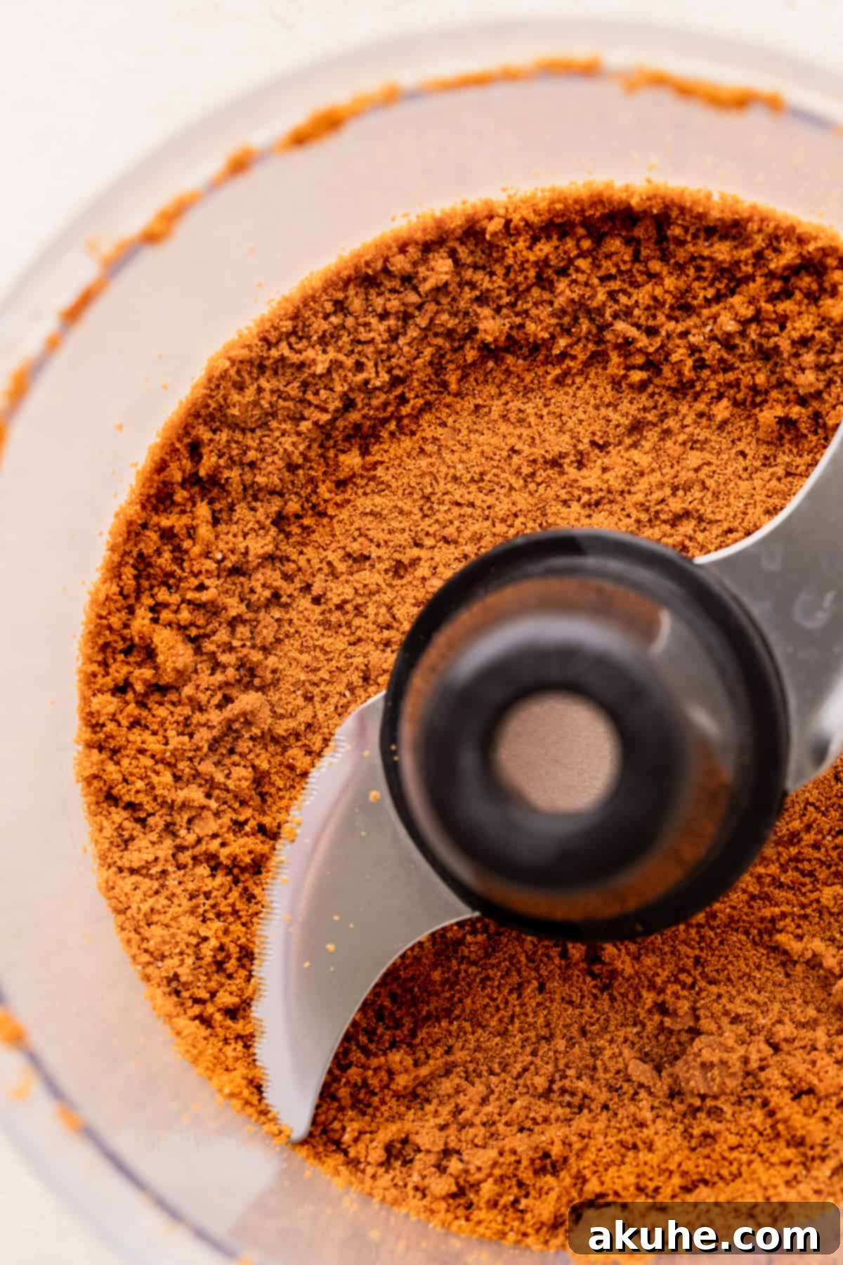 Irresistible Biscoff Cupcakes 4 Finely crushed Biscoff cookie crumbs in a food processor, ready to be added to the batter.