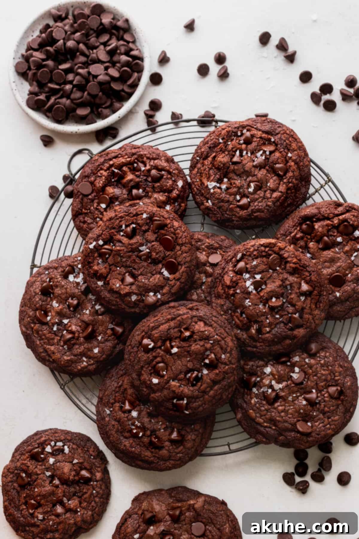 Ultimate Fudgy Crinkle Cookies 9 All of the brownie crinkle cookies neatly arranged on a circle wire rack, showcasing their abundance.