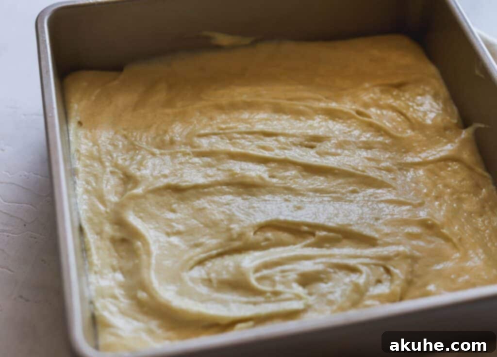 Effortless Strawberry Shortcake Delights 5 Lemon cake batter in a pan, ready for baking.